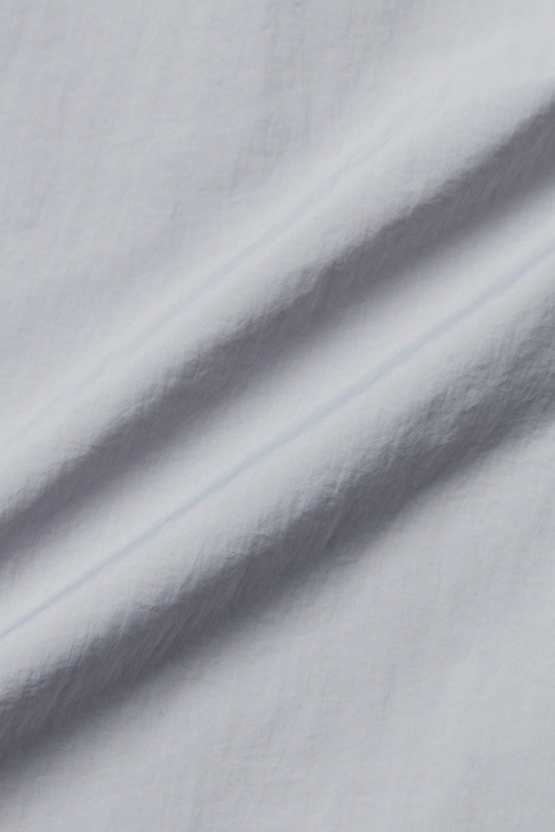 NORWICHI6 パッカブルリバーシブルナイロンコート / AVIO・CORDA スチールブルー・キナリ